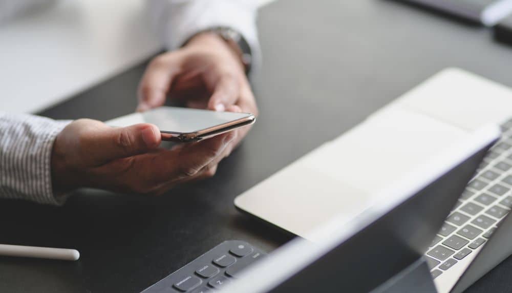 Businessman using smartphone.