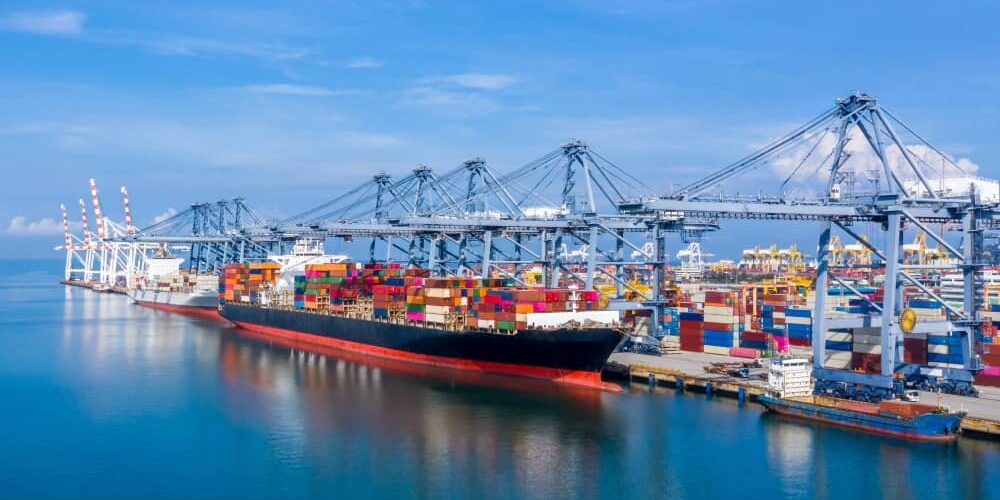 A cargo ship in an industrial port.