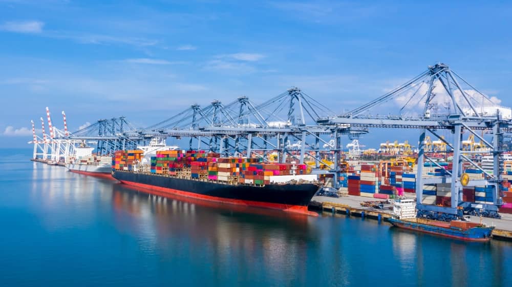 A cargo ship in an industrial port.